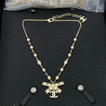 CC Bow Tie Diamond Gold Necklace