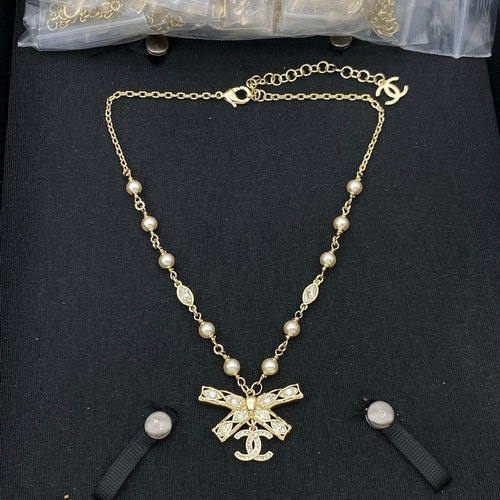CC Bow Tie Diamond Gold Necklace