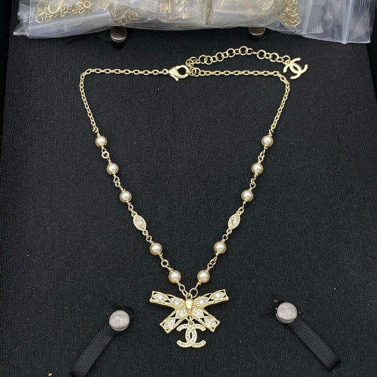 CC Bow Tie Diamond Gold Necklace