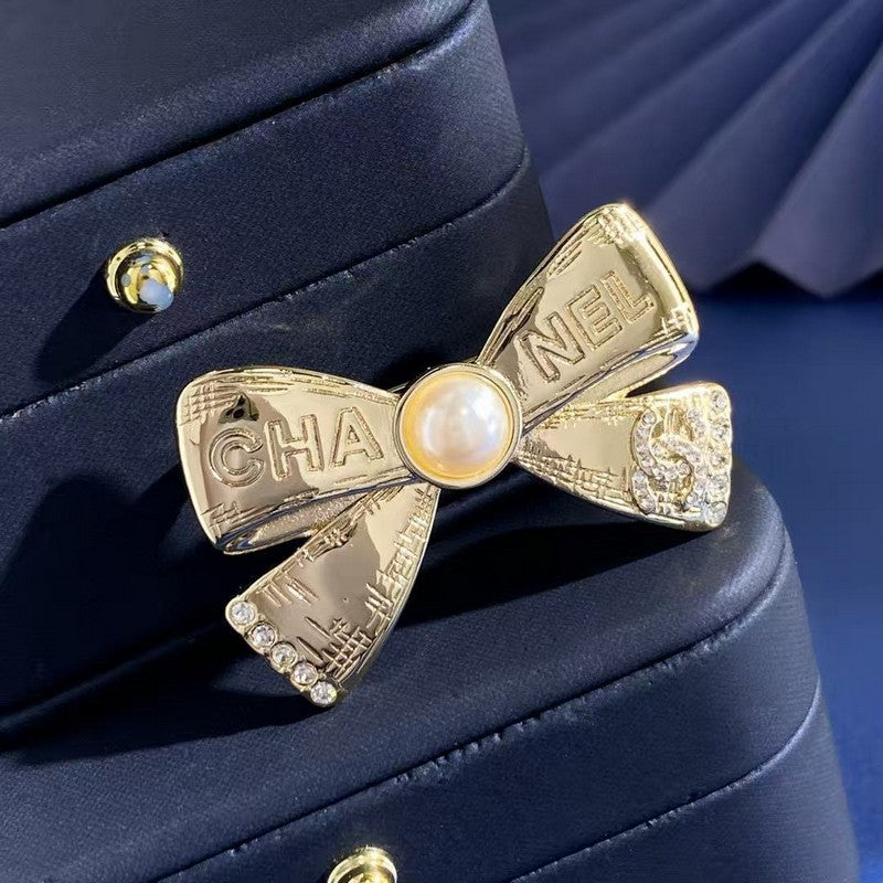 CC Bow Tie Gold Brooch
