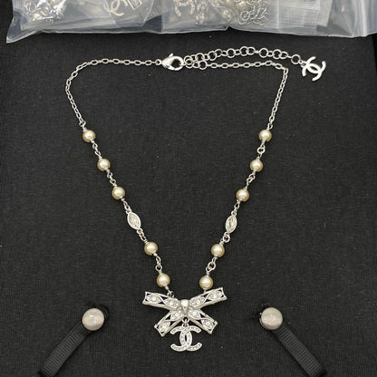 CC Bow Tie Diamond Gold Necklace